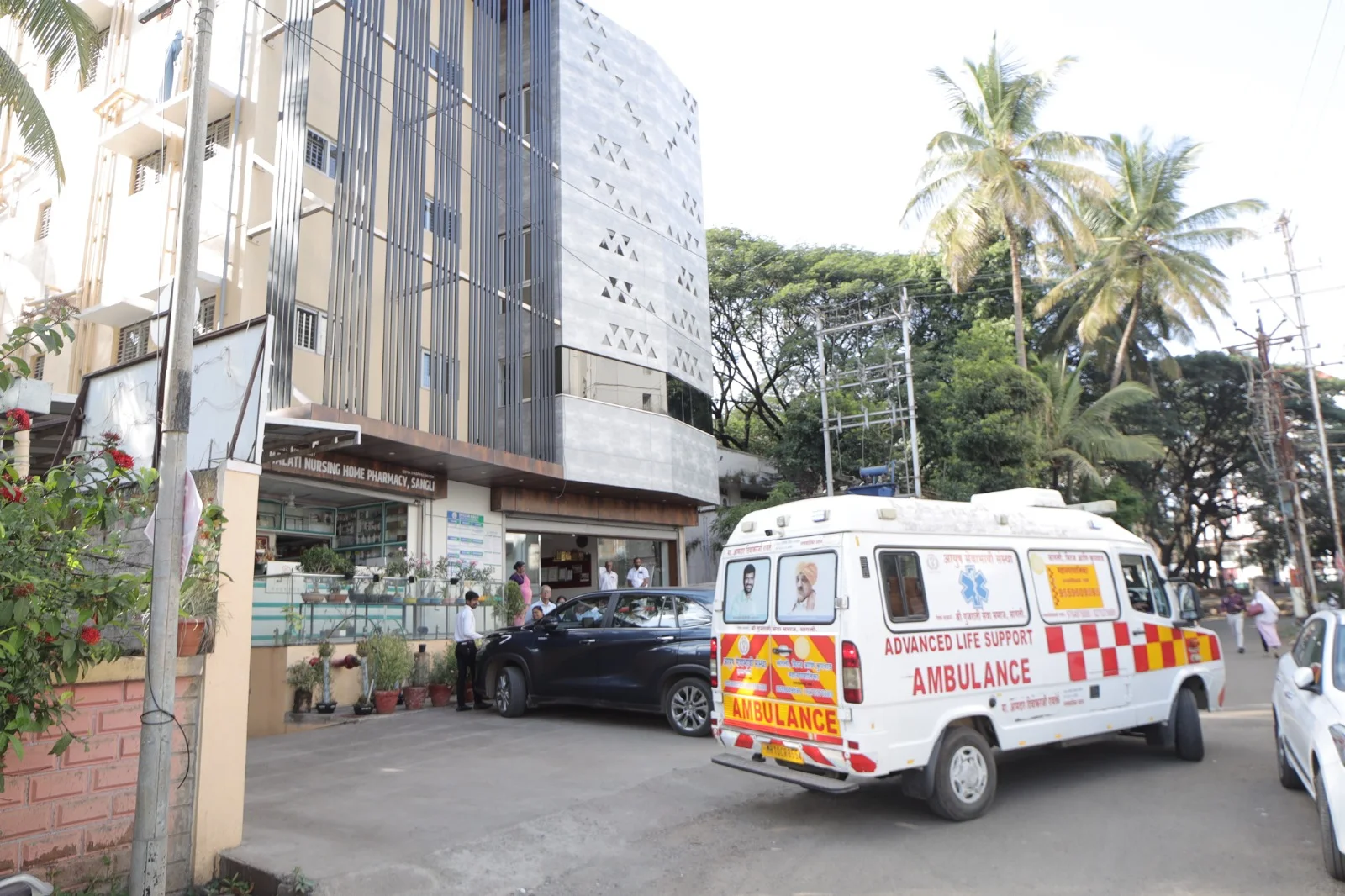 Ambulance photographed beside the Deccan Malti Hospital building