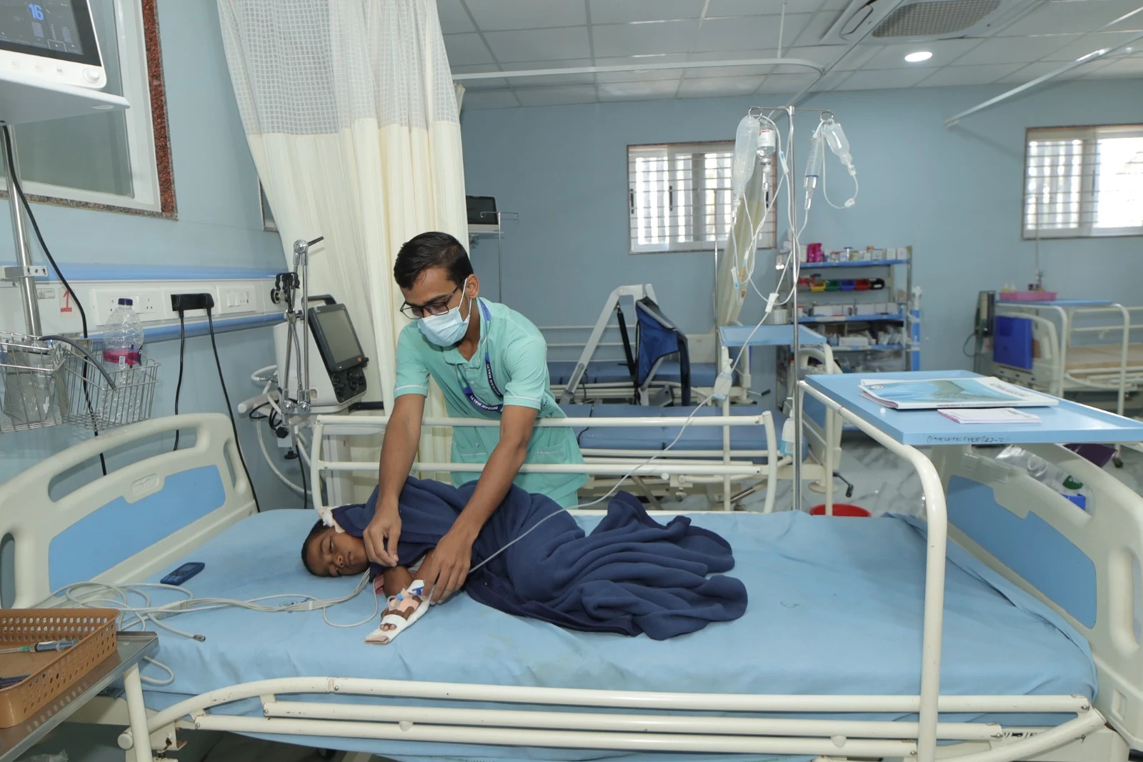Healthcare professional providing bedside care to a patient